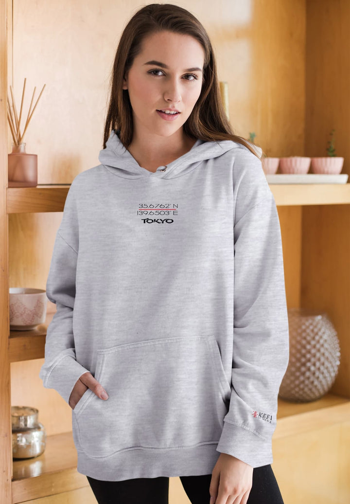 A lovely woman becomes a living testament to comfort and style in a gray pullover hoodie.