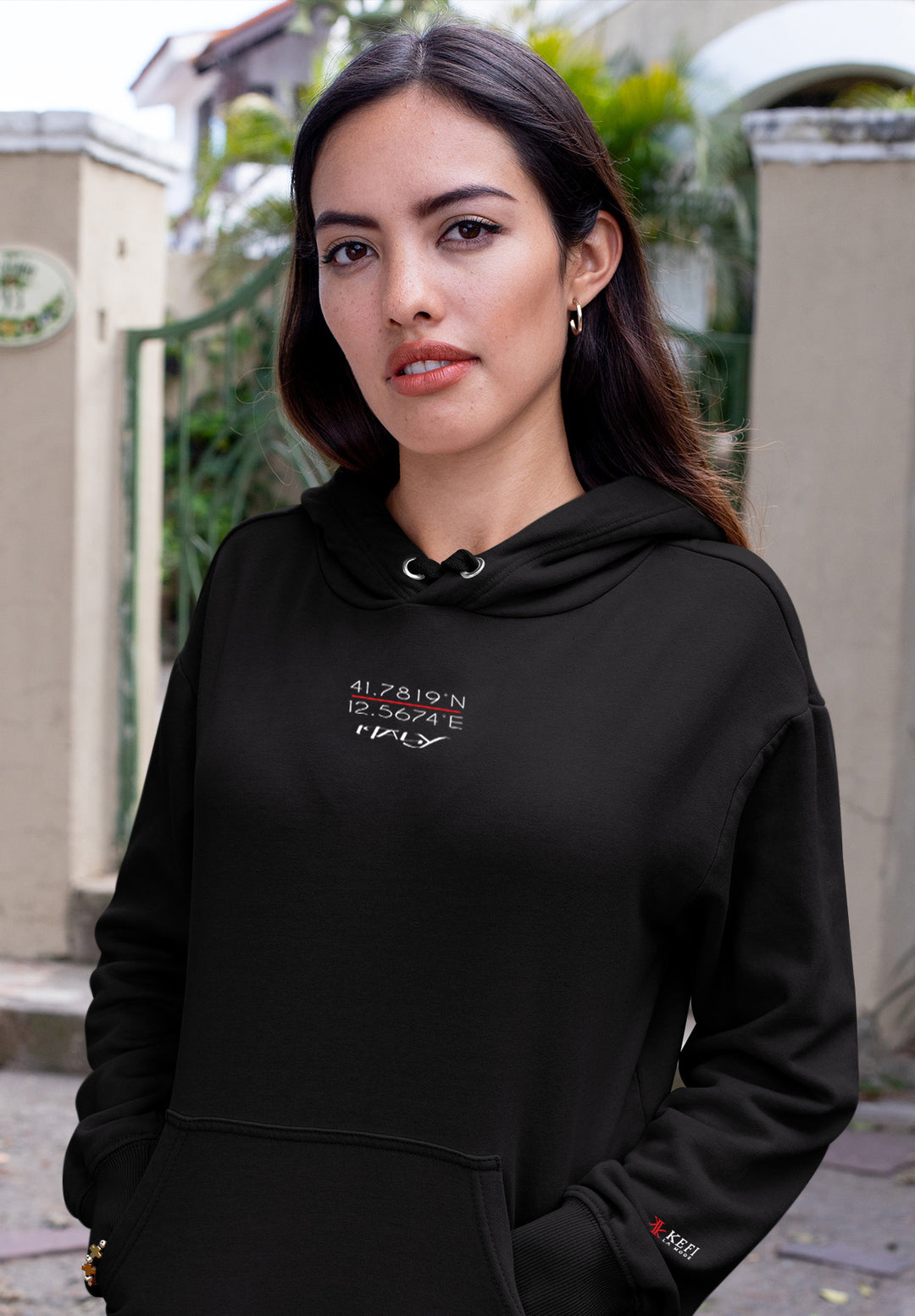 The black hoodie worn by the female serves to enhance her fashion expression