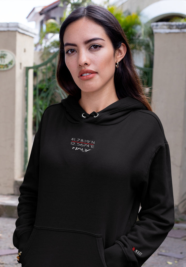 The black hoodie worn by the female serves to enhance her fashion expression