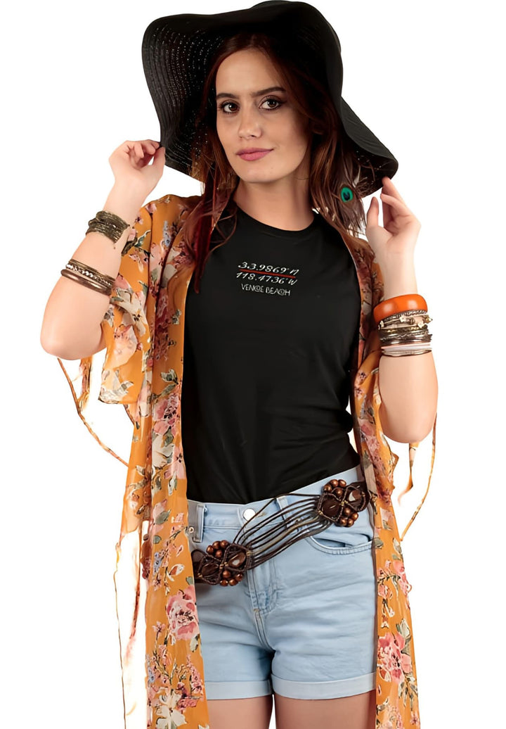 In her black hat and tee, she exudes a captivating simplicity that echoes the quiet strength and individuality within her.