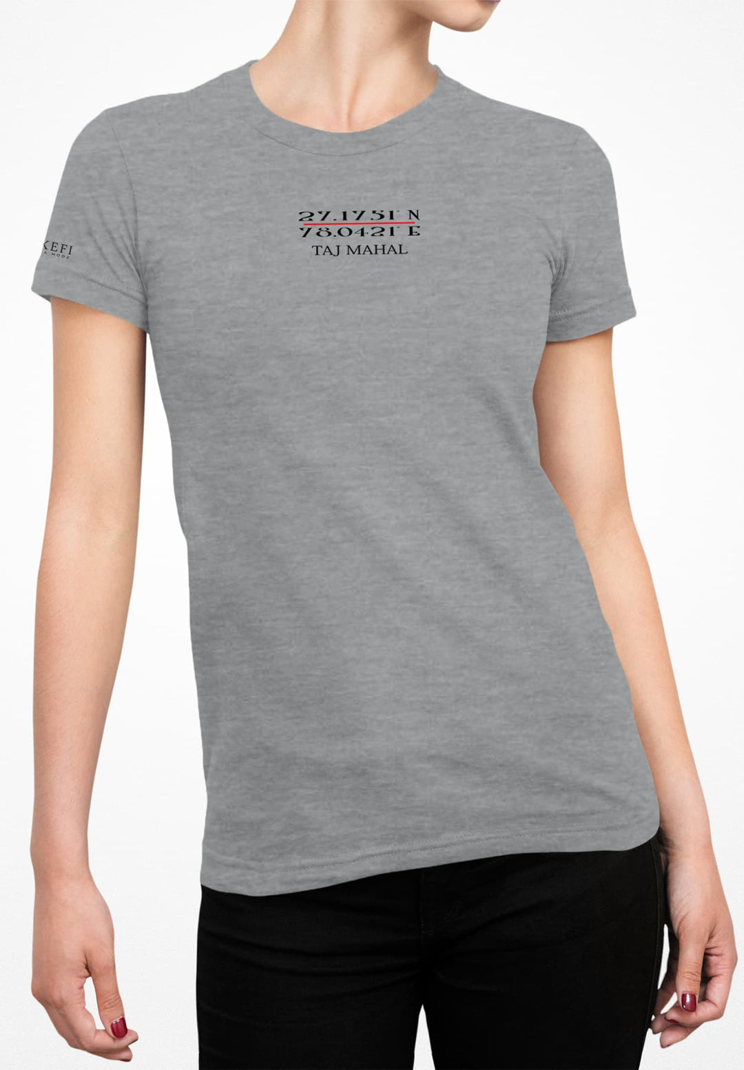 In a gray T-shirt and black jeans, she captures casual style and sophistication.