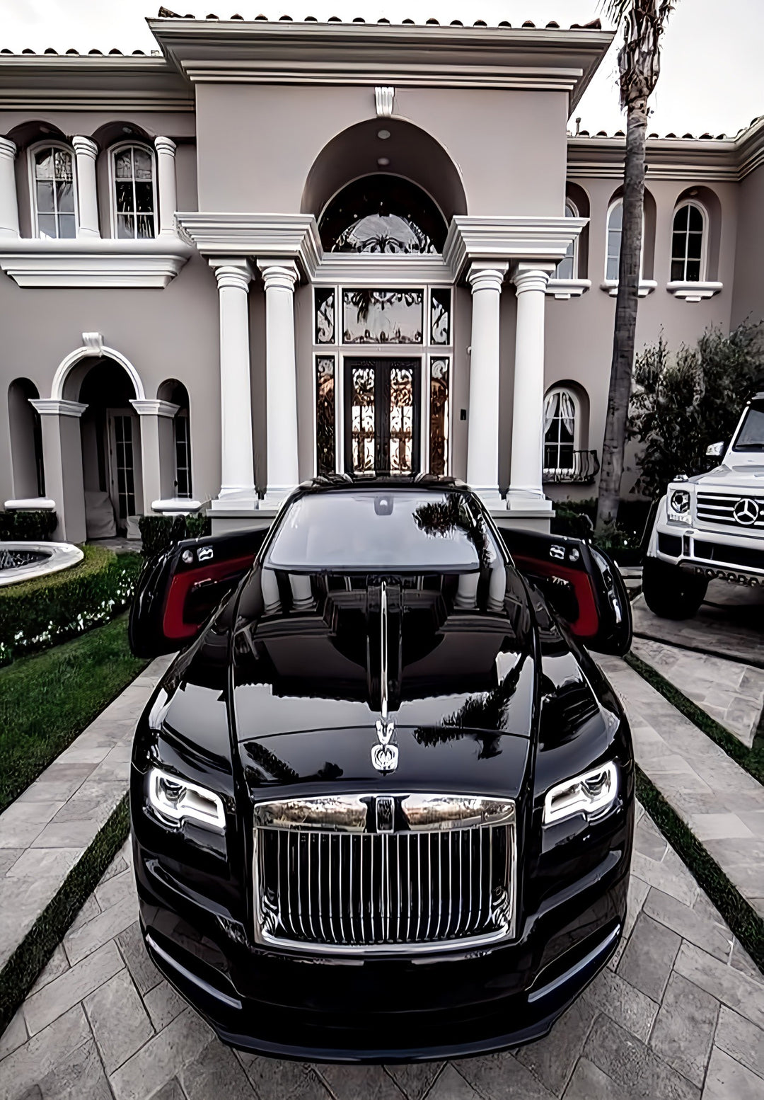 A glamorous black Rolls-Royce vehicle parked in front of a house.