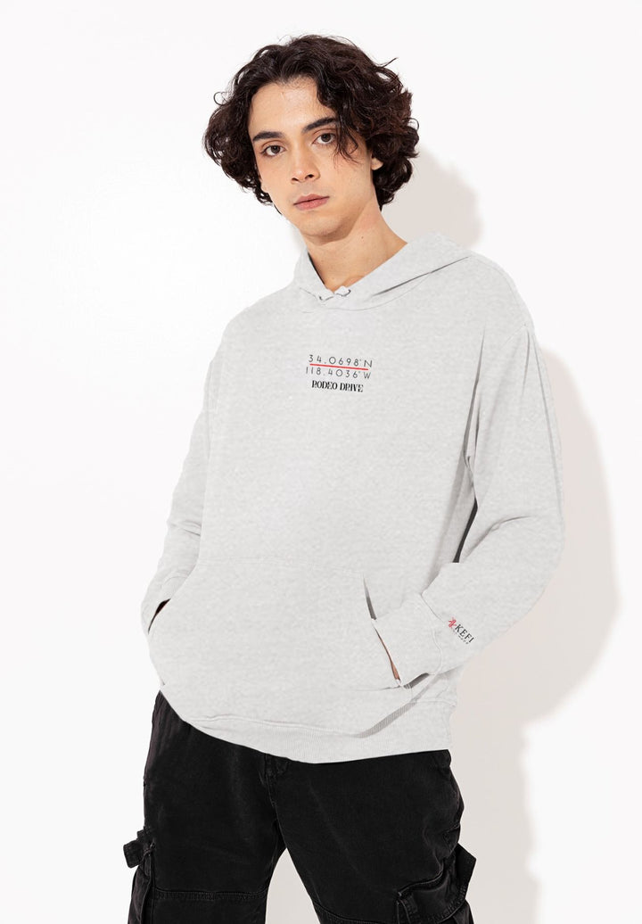 The guy displays his fashion sense with a gray hoodie with Rodeo Drive coordinates.