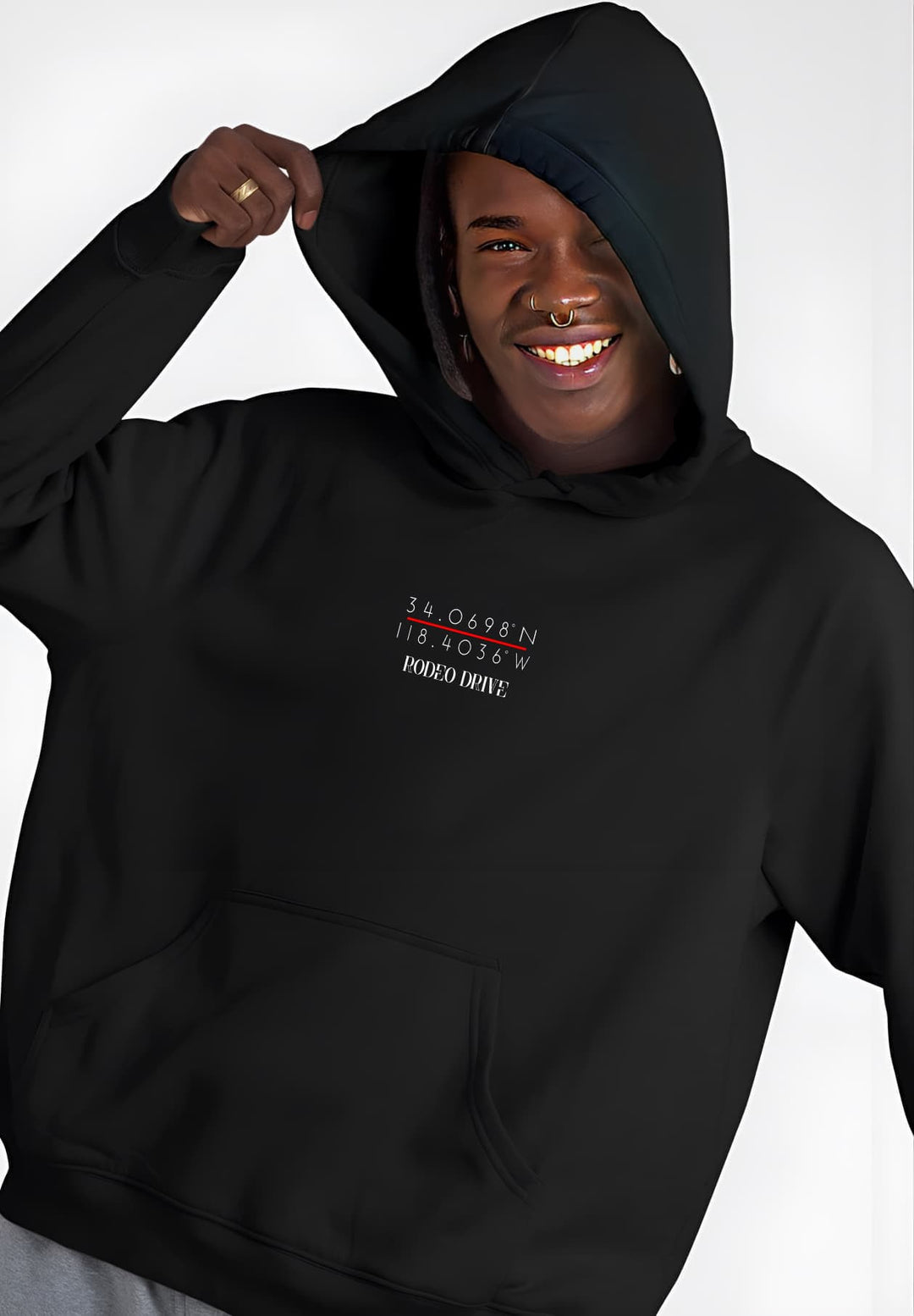In a black hoodie with Rodeo Drive coordinates, the man exudes flair and luxury.