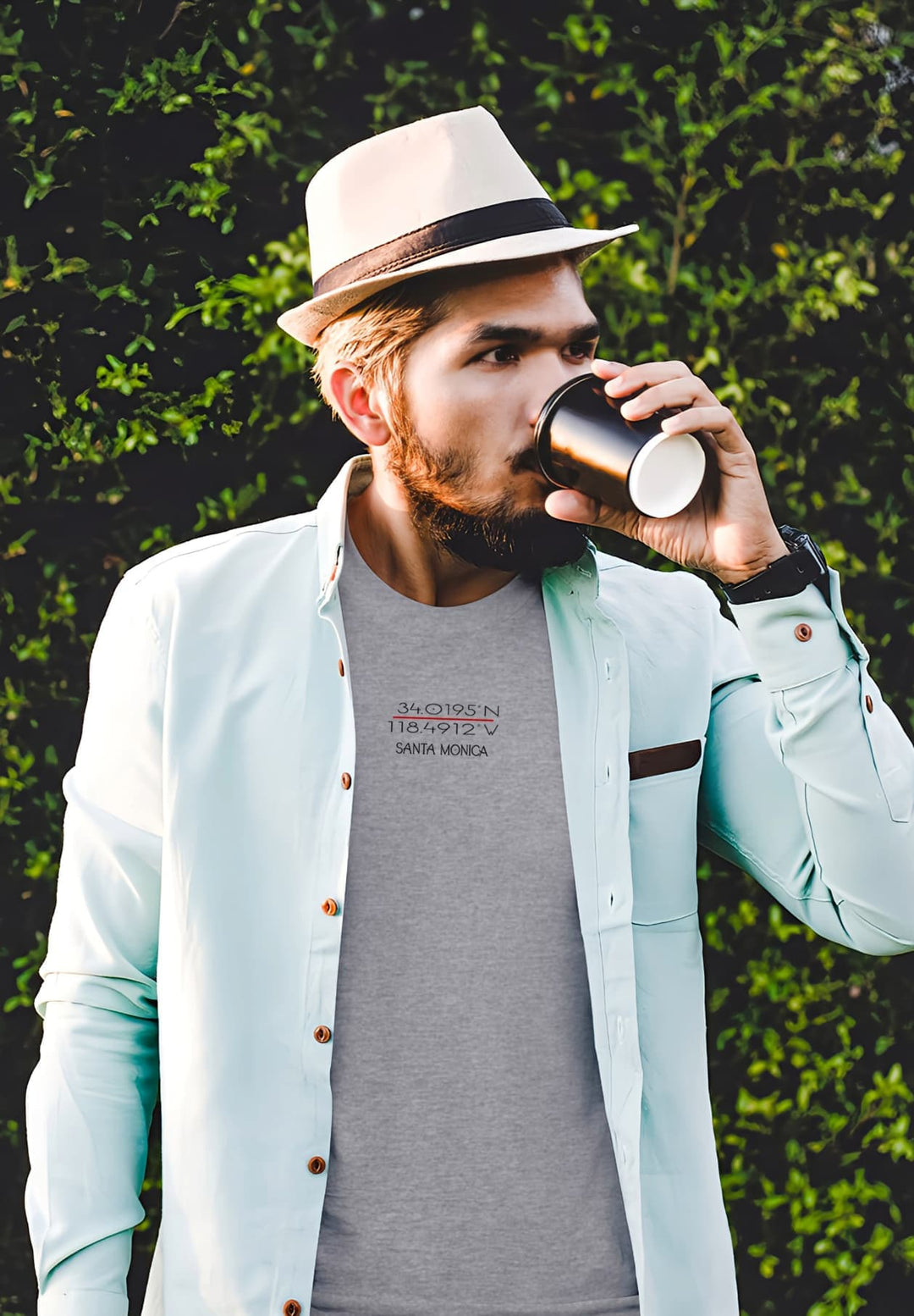 With each sip, his heathered gray tee becomes a vessel for moments of calm, memories woven into its fabric.