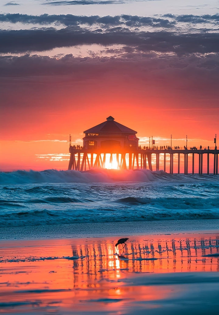 Huntington Beach turns into a warm-hued canvas as the sun sets, creating a stunning sunset.