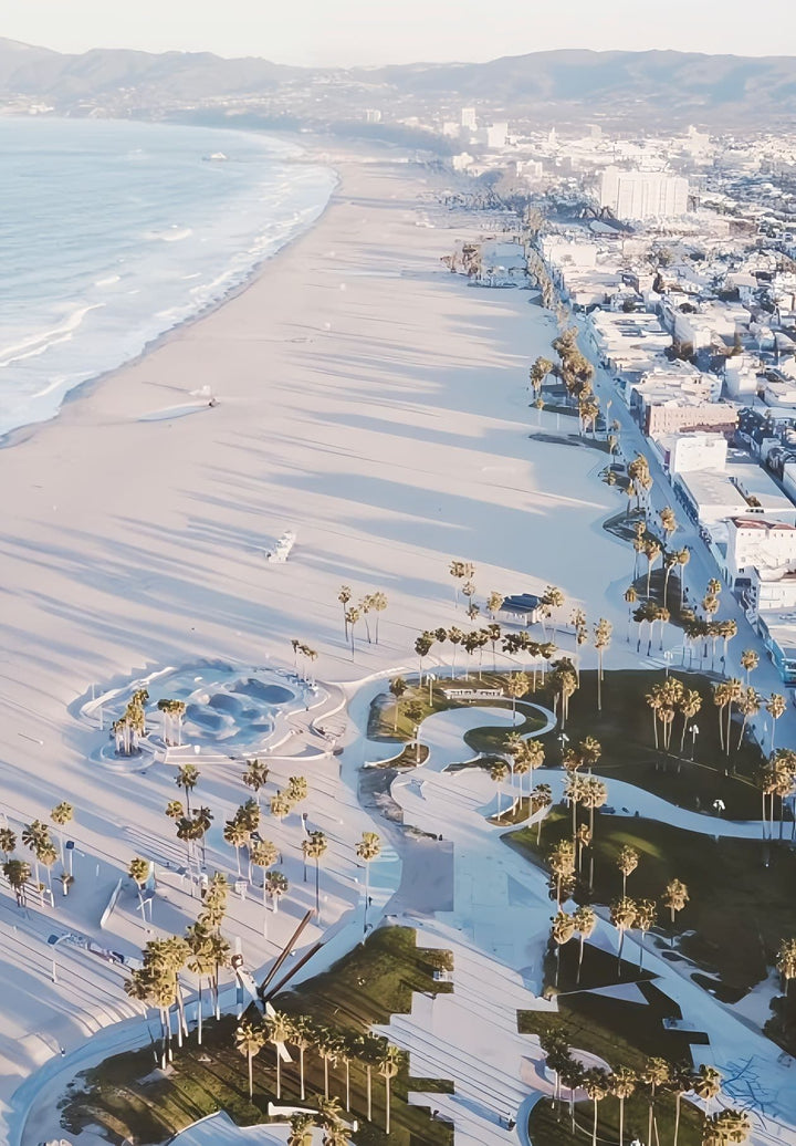 The aerial image captures the essence of Venice Beach—a vibrant, ever-evolving community where sun, surf, and a bohemian spirit converge.
