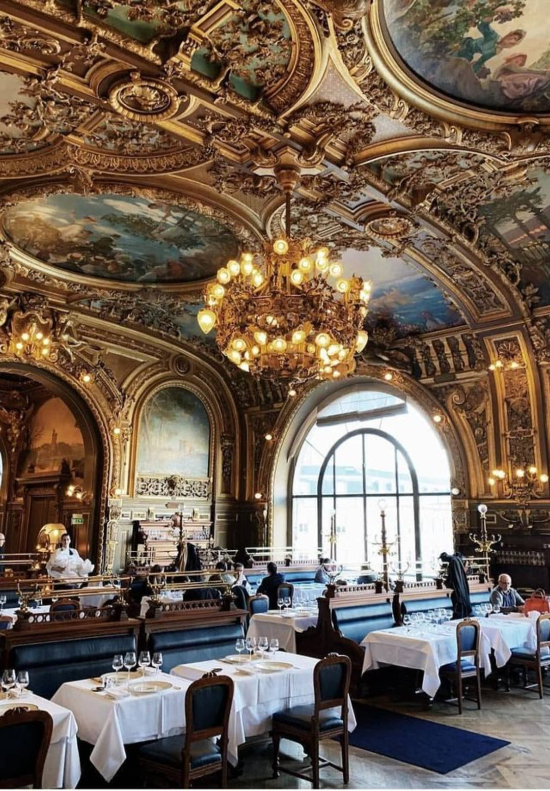 The breathtaking interior of the Le Train Bleu restaurant in Paris, which is located in Paris, France.