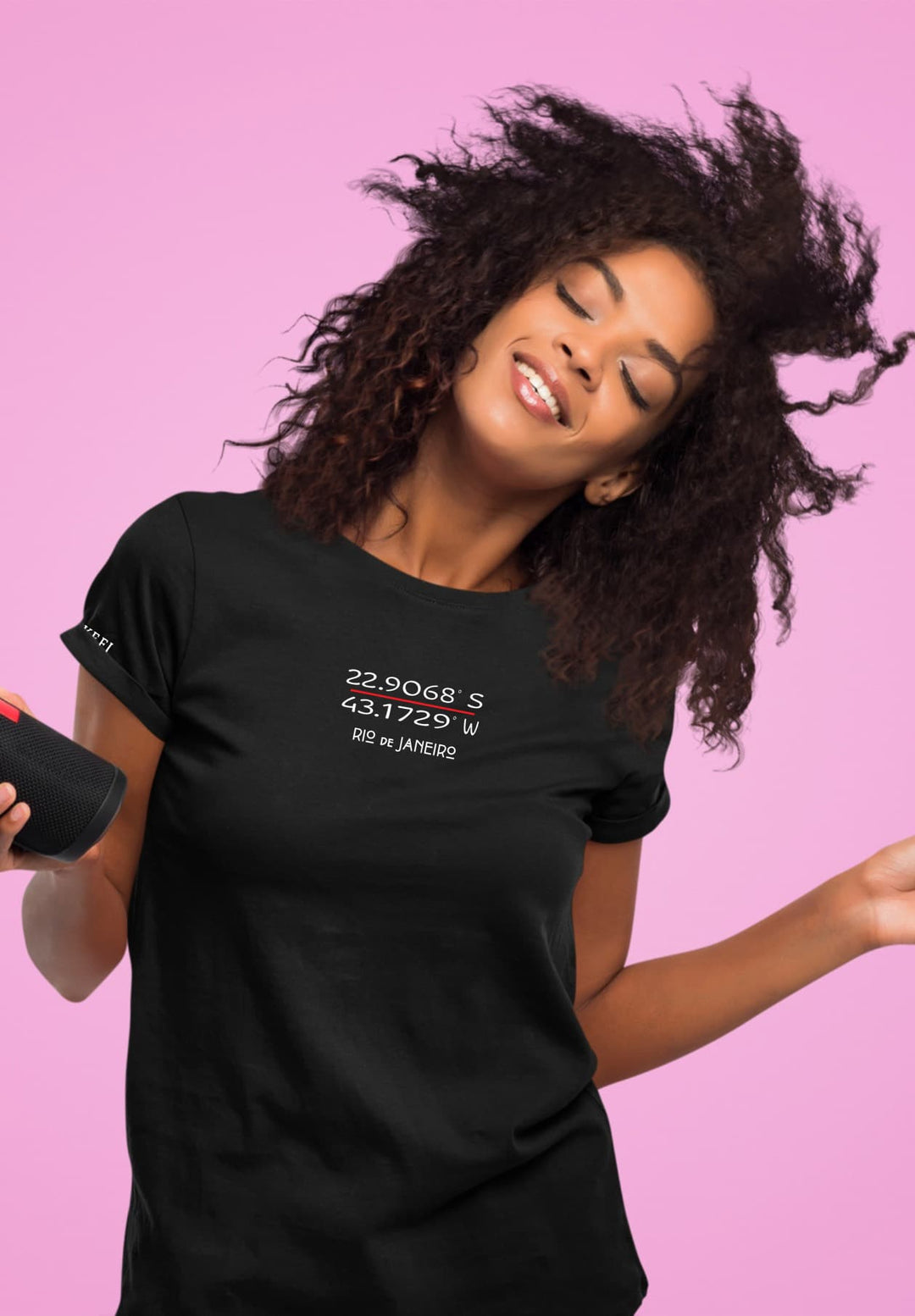 She wears a black T-shirt while she holds a little speaker, the music coordinating with her heartbeat.