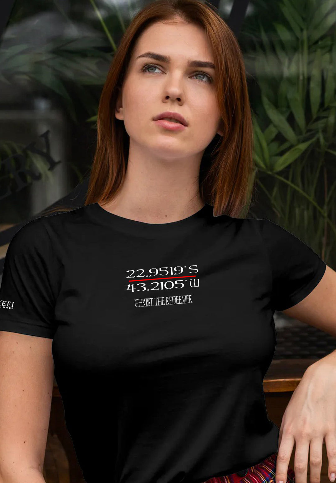 Seated on a bench, a woman clad in a black shirt exudes an aura of quiet contemplation and serene strength, embodying a moment where simplicity intertwines with emotional depth.