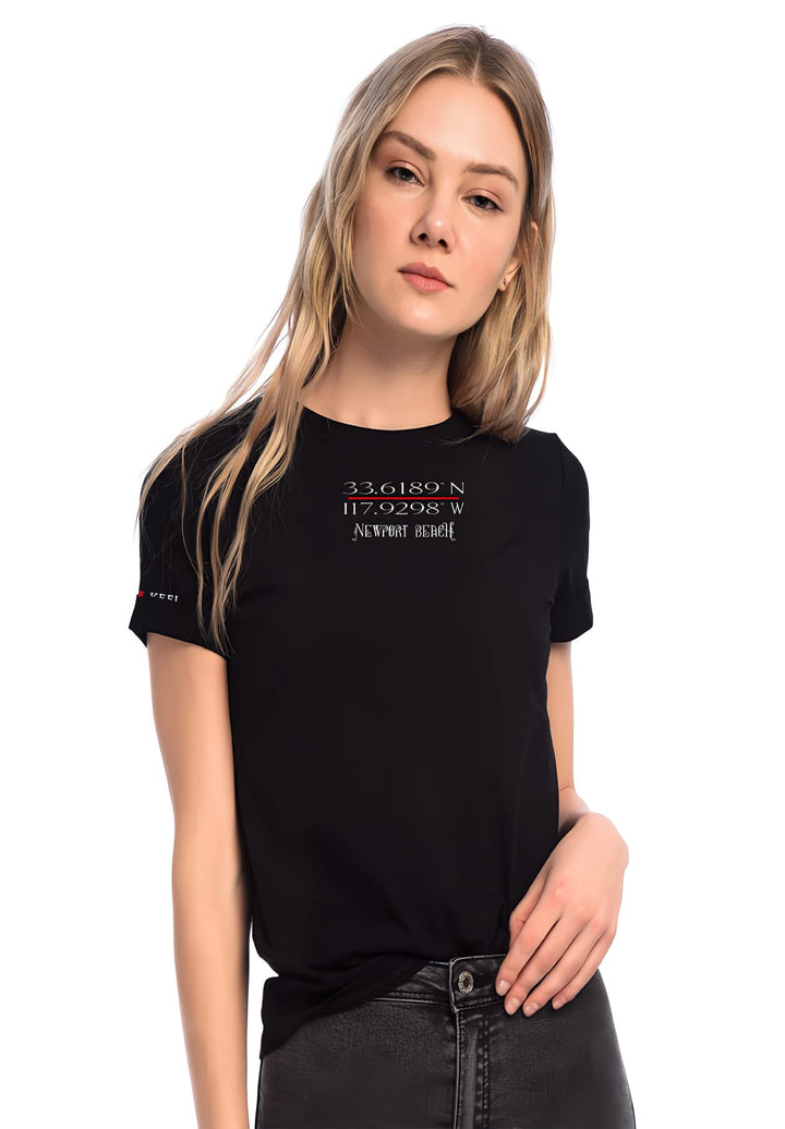  With an aura of confident grace, she stands tall in a black t-shirt, a silhouette of fashion and style. 