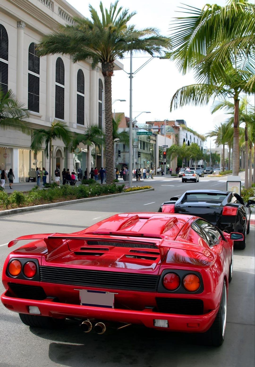 Rodeo Drive in Beverly Hills, California, filled with expensive cars.