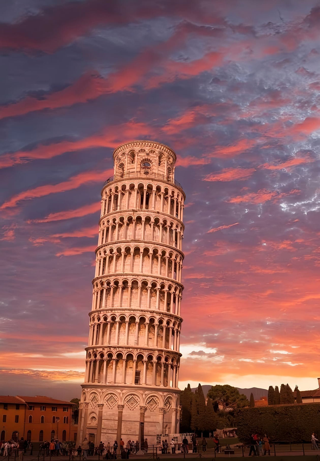 The Leaning Tower of Pisa serves as the central attraction during an evening in Tuscany, Italy.