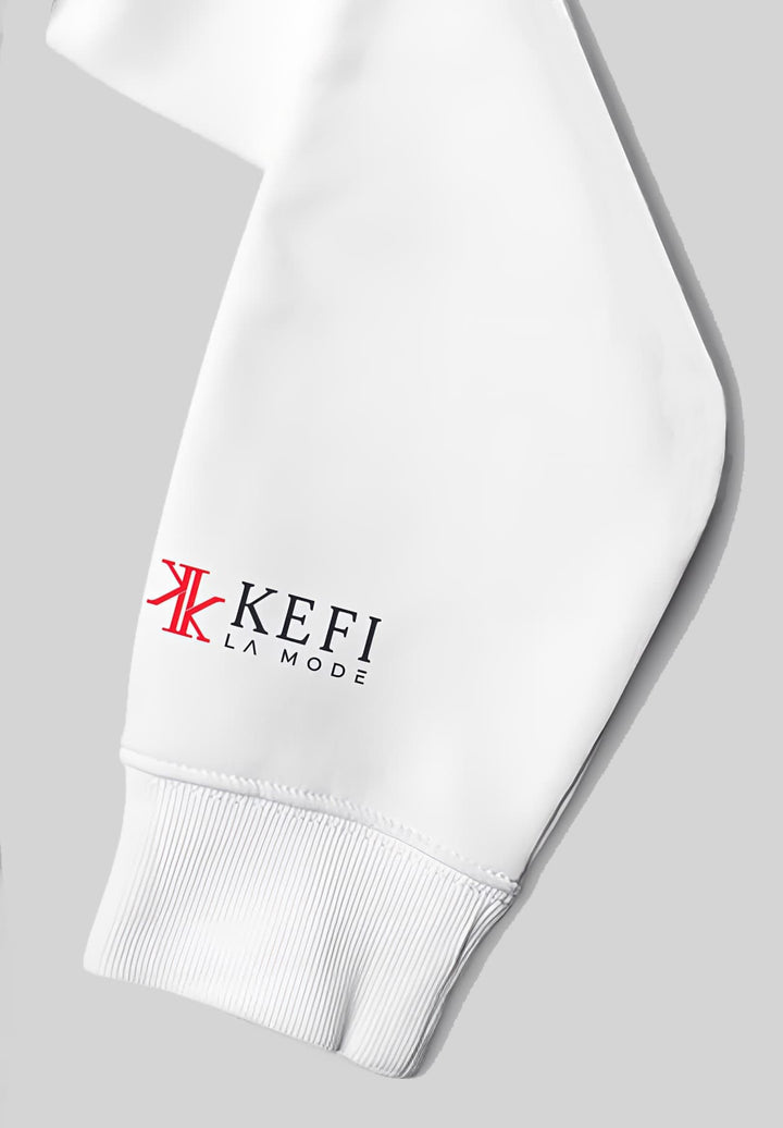 In the world of fashion, the left sleeve of the white hoodie is a showcase for the Kefi La Mode logo's sophistication.