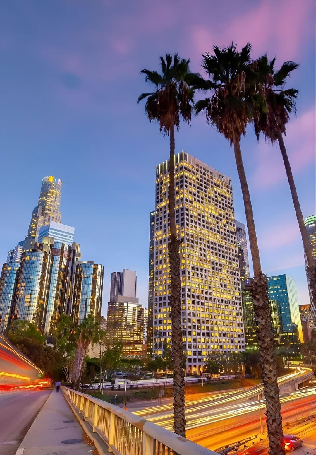 At twilight, observe the cityscape and the freeway in Los Angeles, California.