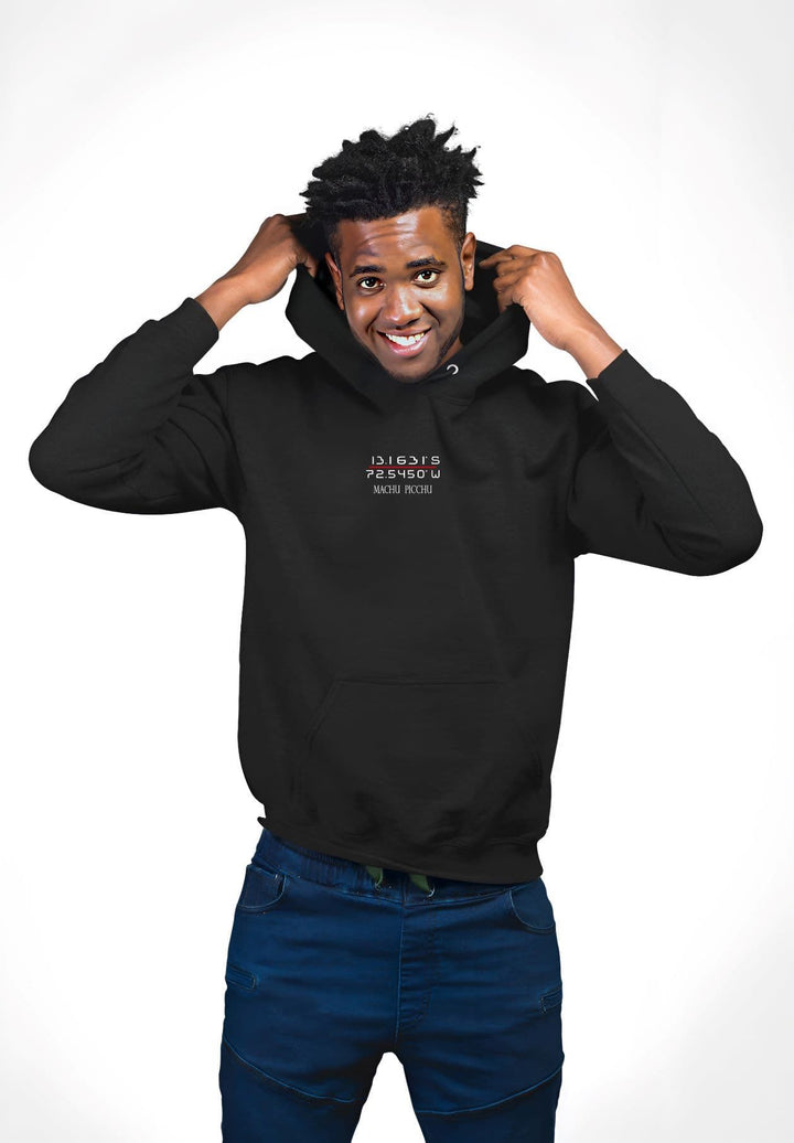 A man striking a pose while making adjustments with his GPS black hoodie.