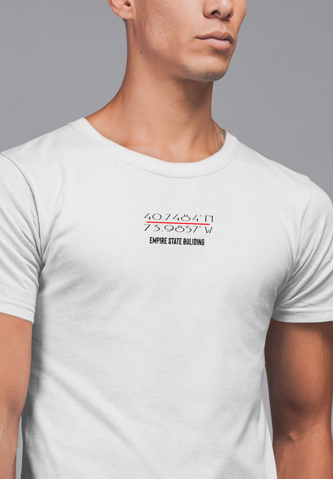 In the embrace of coordinates on a white tee, the man's pose whispers tales of journeys, love, and heartfelt destinations.