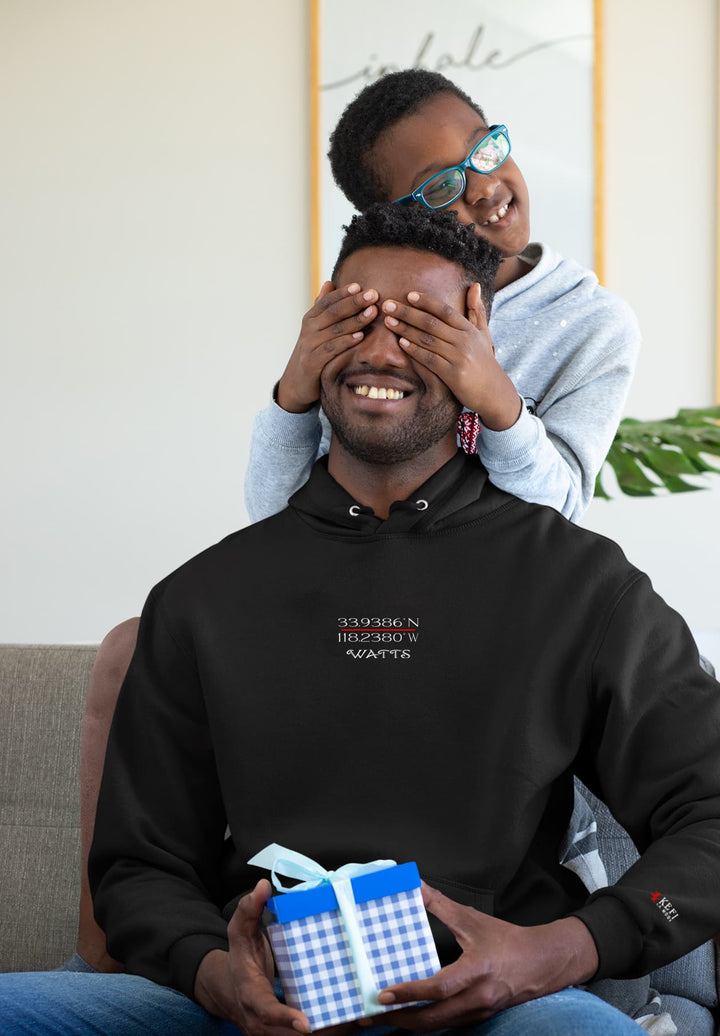 The man's black sweatshirt symbolizes warmth and connection with each chuckle, while the child's pleasure adds pure bliss.