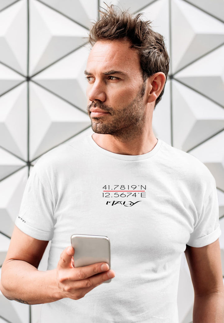 In a white tee, his grasp on the cell phone echoes connection that captures a bridge to shared moments, emotions, and understanding.