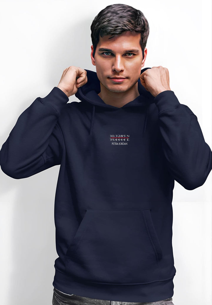 A man rocks a blue Petra hoodie displaying the KEFI La Mode logo.