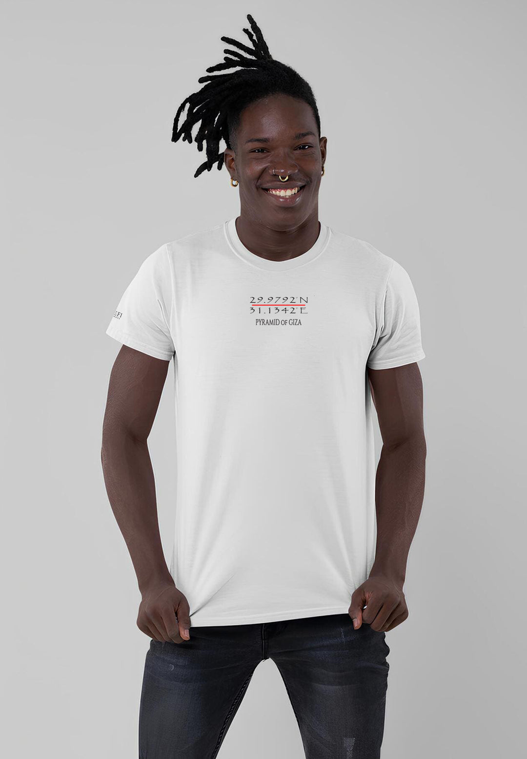 Amidst the strands of dreadlocks, the man's smile in a white tee becomes a radiant expression of pure, heartfelt joy.