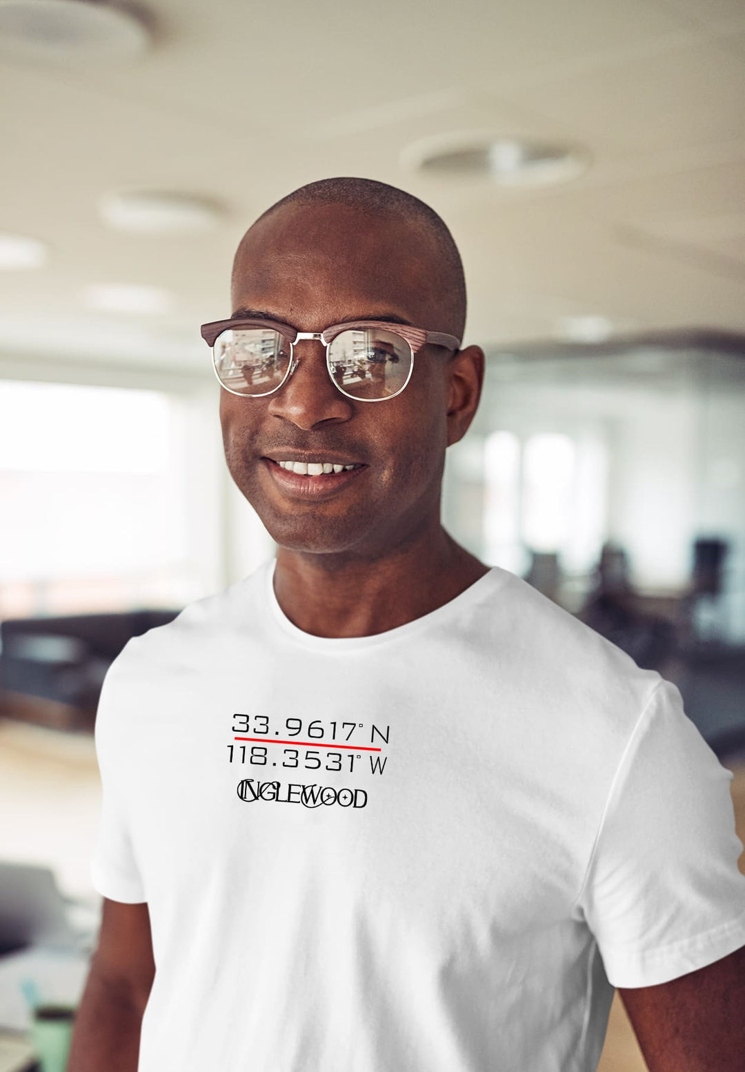 With glasses and a white Inglewood tee, the man's attire becomes an emotional canvas, telling tales of memories, dreams, that are woven in.