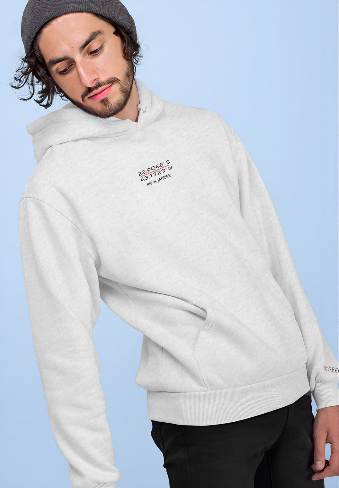 A man sporting a beanie and a gray hoodie with the Rio de Janeiro GPS logo on it.