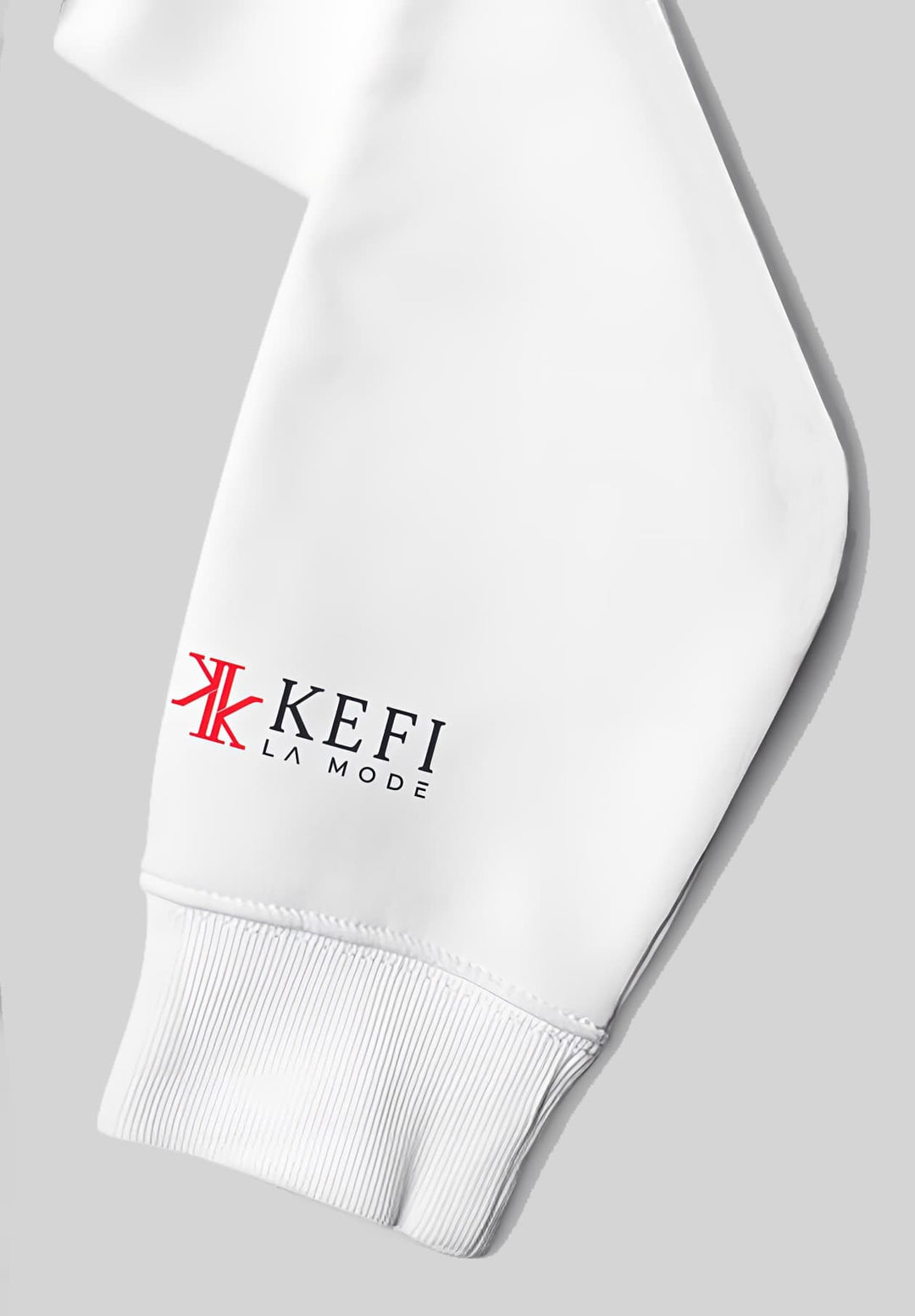 With the Kefi La Mode logo as its muse, the left sleeve of the white hoodie becomes a work of art in the world of fashion.