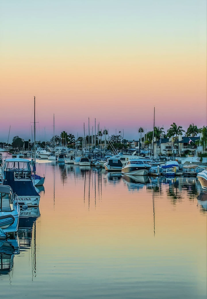 Experience the serene and nautical allure of Newport Beach's waterfront as the seas peacefully rise and fall.