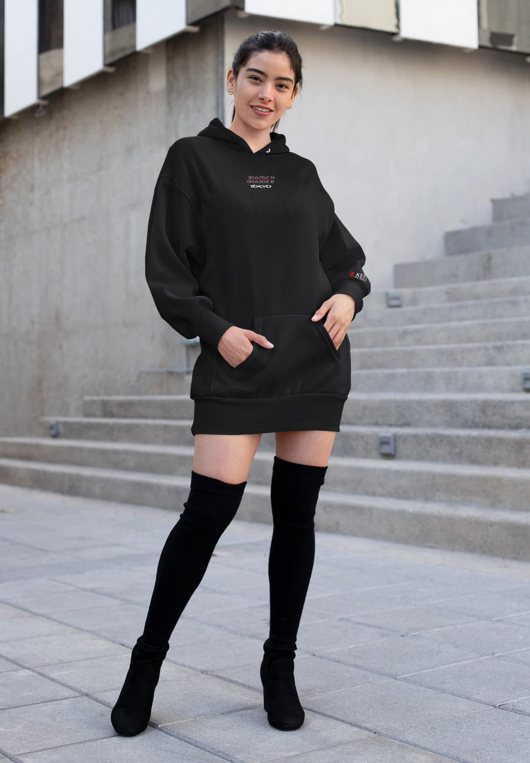 Contrasting with the building's exterior, the black hoodie is more than just clothing; it's a statement. 