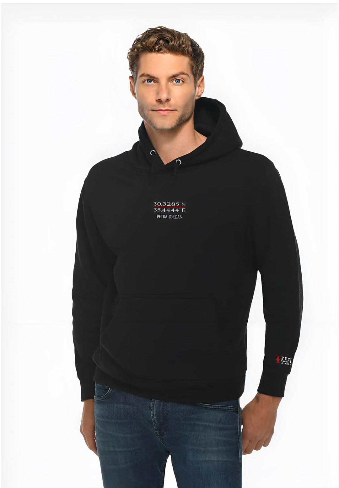 A gentleman tops off his outfit with a black Petra hoodie showcasing the KEFI La Mode logo.