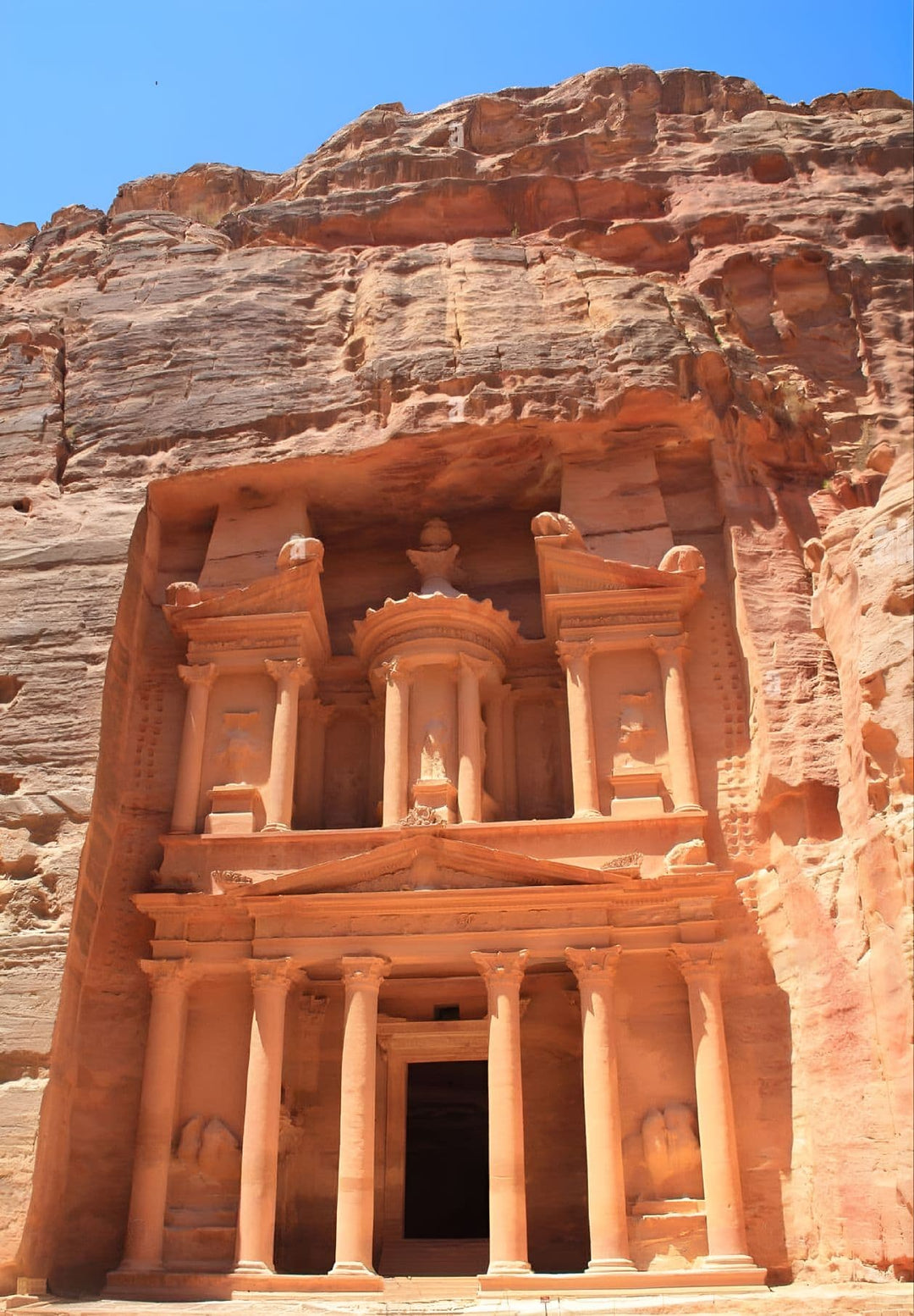 Petra is half-built, half-carved into the rock, and is surrounded by mountains riddled with passages and gorges. 