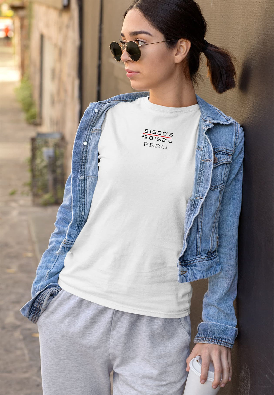 Effortlessly chic, she embodies style in a white tee, a canvas for her confidence, expressing a touch of casual allure.