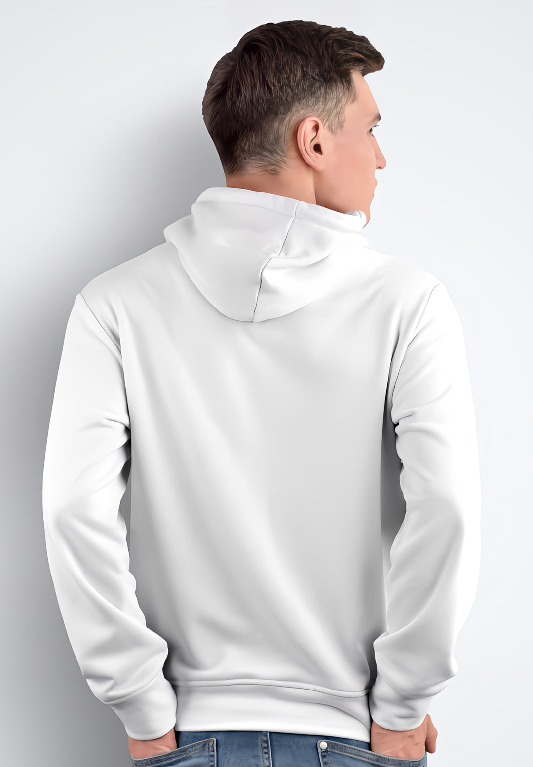 Utilizing his fashion acumen, the man masterfully reveals the trendy back view of his white hoodie, making a statement with every step.