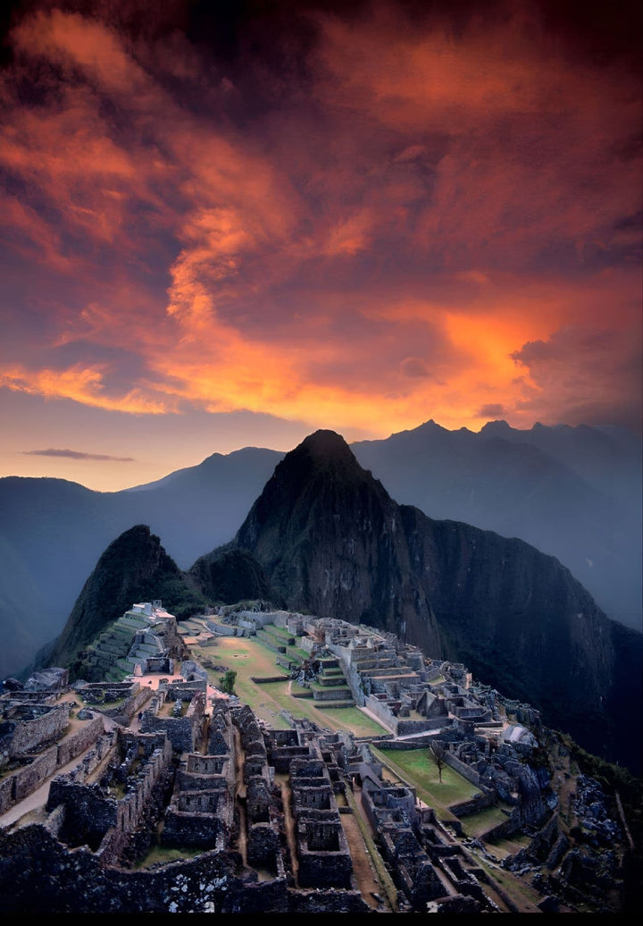 As the sun tenderly kisses the Peruvian sky, Machu Picchu bathes in the golden glow, a timeless spectacle merging the marvels of nature and ancient human ingenuity.