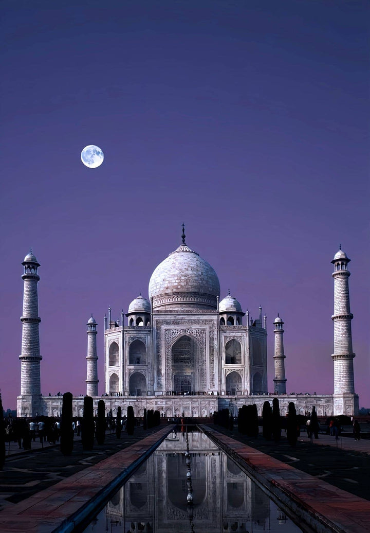 The Taj Mahal gleams illuminated by the radiance of a complete lunar phase.