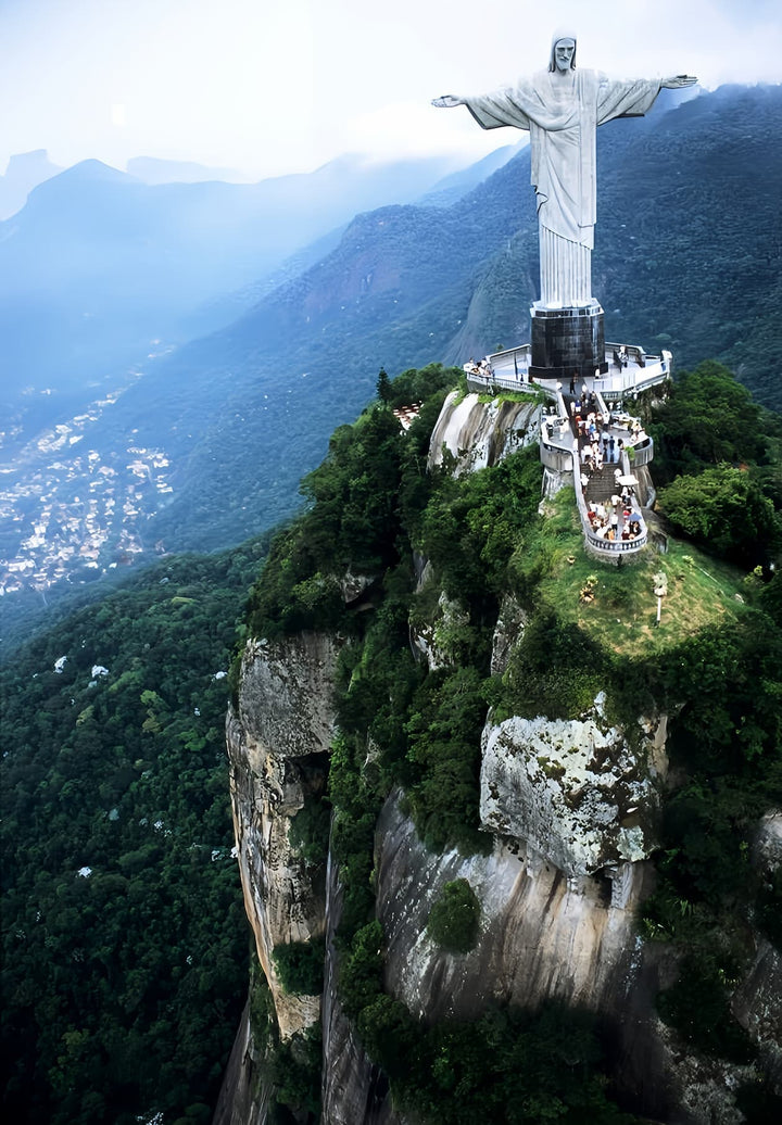 On top of a mountain is where you'll find the statue of Christ the Redeemer.