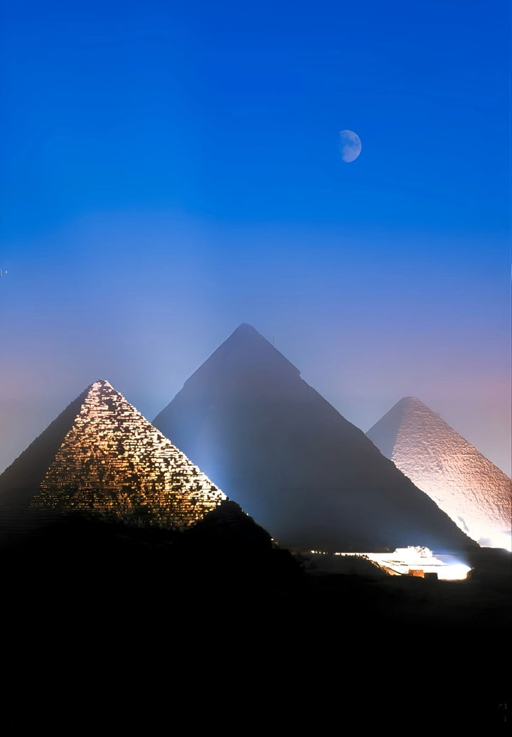 Beneath the Egyptian nocturnal canopy, the trio of Giza pyramids radiate, emitting a mesmerizing luminescence.