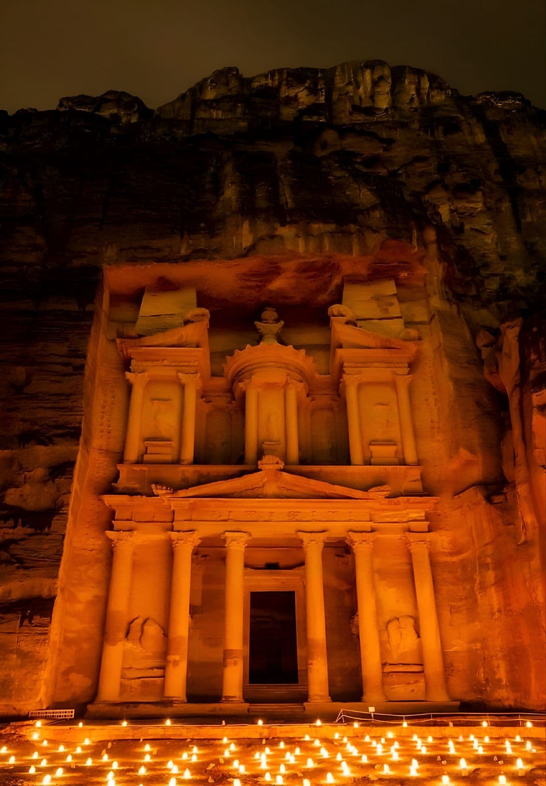 Petra, Jordan, at night, showing the Treasury Khasneh. 1800 candles were used to change Petra at night.