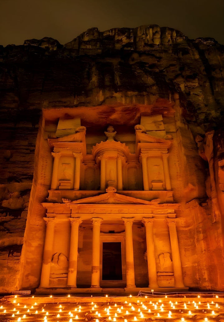 In the nocturnal embrace of Petra, the Treasury (Khasneh) glows under 1800 candles, casting a spell that transforms the ancient city into a mystical wonderland.
