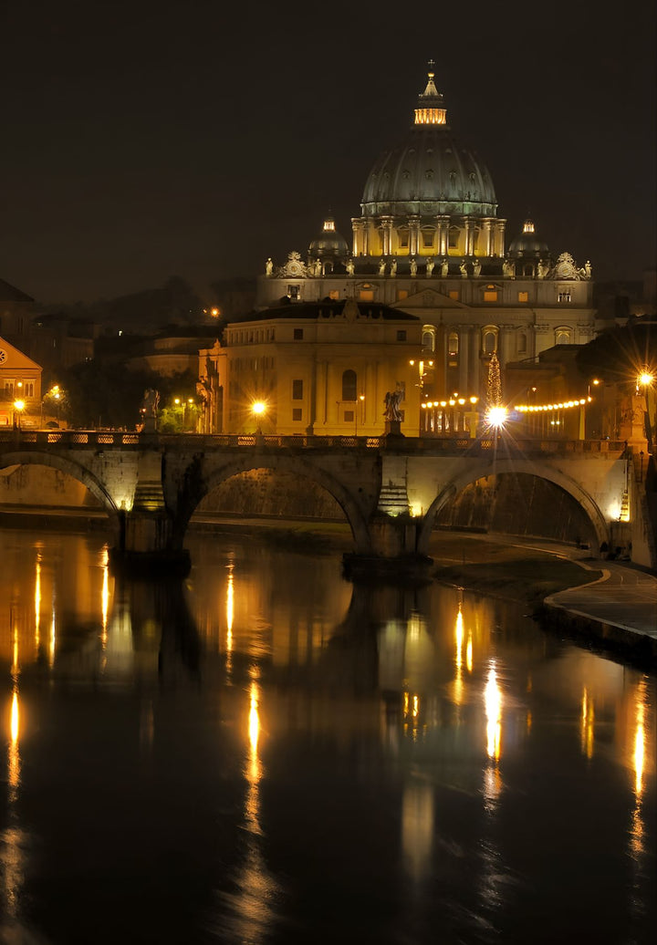 Saint Peter`s Basilica, The world`s largest church, at nighttime; Vatican City, Italy.