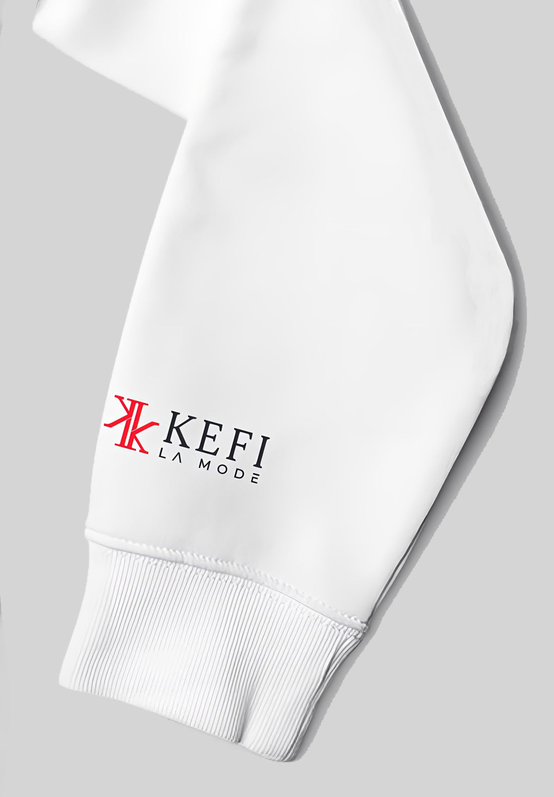 A striking display on the white hoodie sleeve, the KEFI La Mode logo catches the eye.