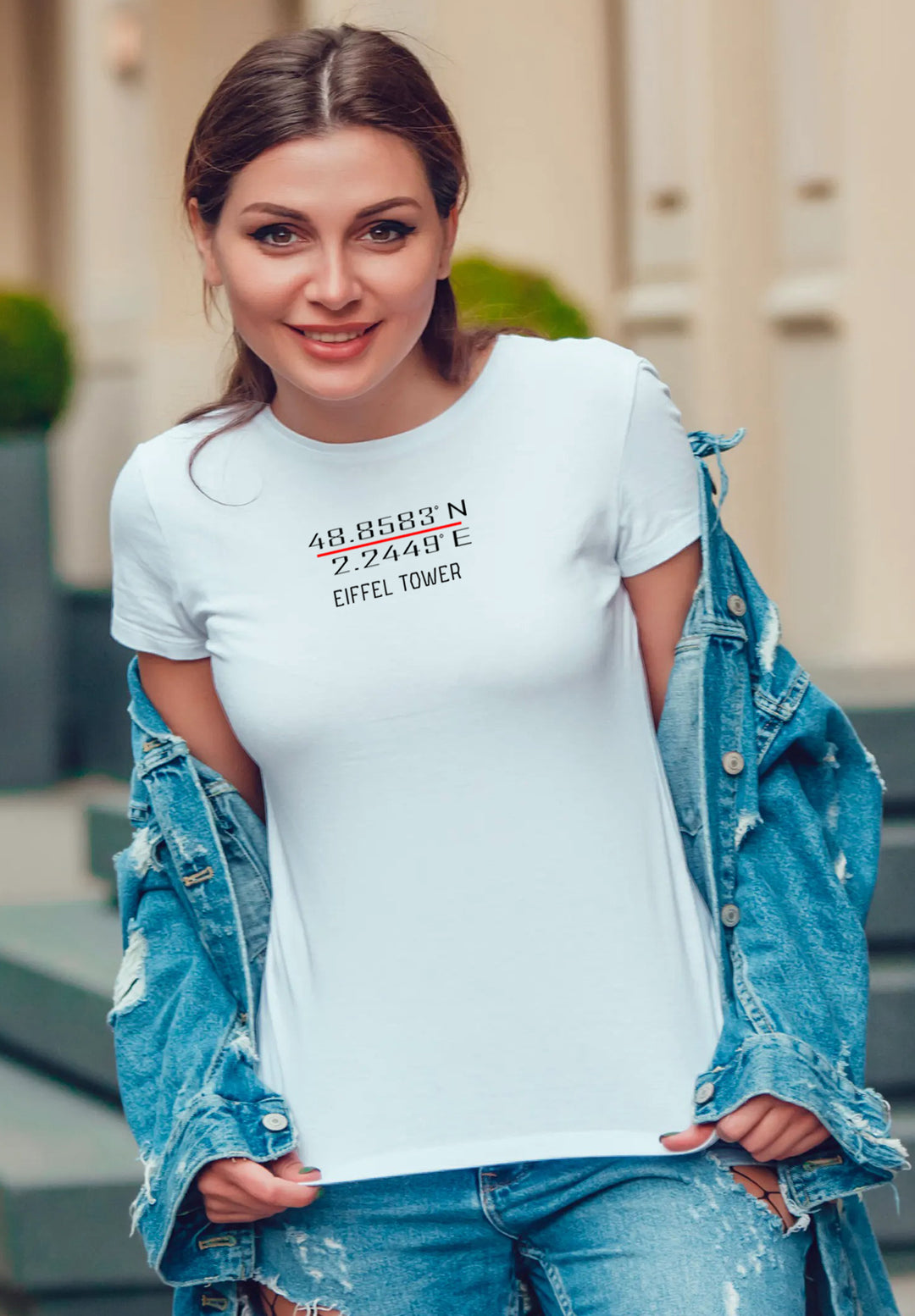  Graceful style—woman stands, adorned in a white tee and jean jacket, evoking a blend of comfort and chic allure. 