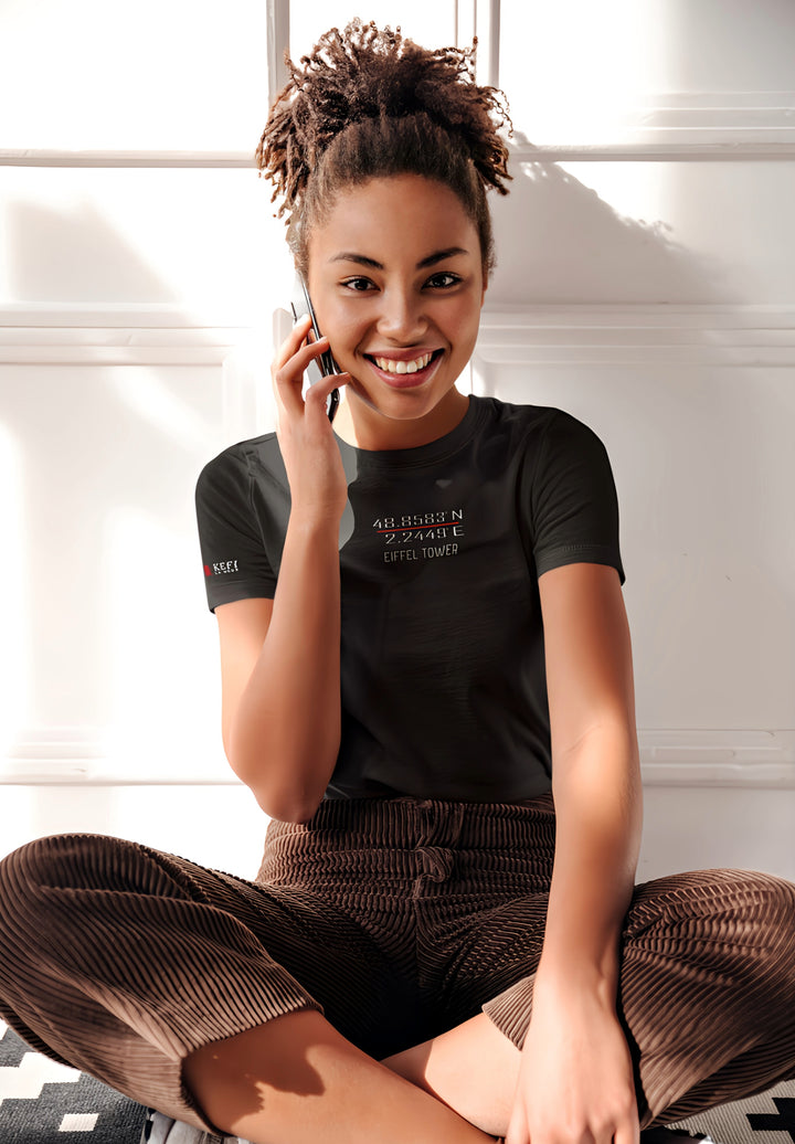  Radiant moments unfold—a woman, draped in casual elegance, converses on her phone, donned in a comfortable round neck tee. 