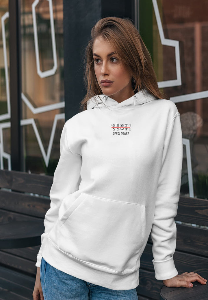 In a quiet moment by the bench, her white hoodie, adorned with the iconic Eiffel Tower coordinates, spoke of an understated elegance intertwined with the romance of Paris.