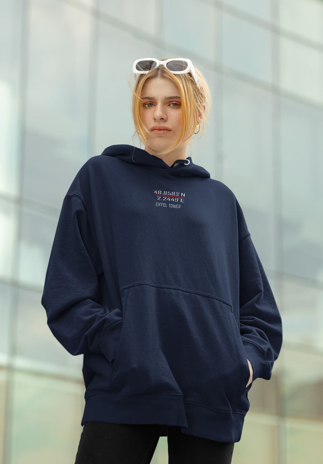 An oversized hoodie and sunglasses on the woman's head conveyed a sense of casual elegance.