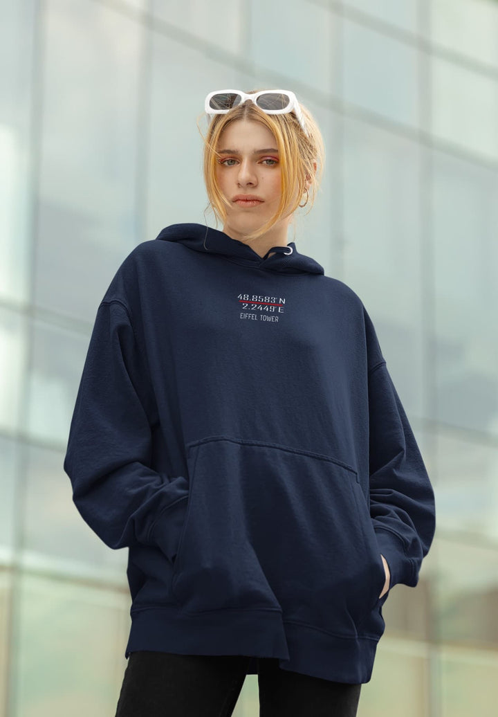 An oversized hoodie and sunglasses on the woman's head conveyed a sense of casual elegance.