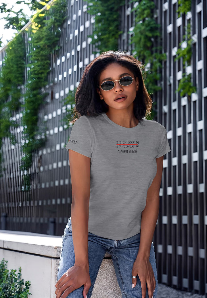 Sitting elegantly in a gray t-shirt, she reflects ease and comfort, giving off a calm and carefree vibe.
