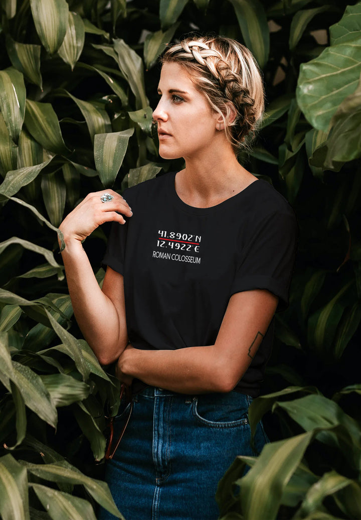 Amid lush greenery, she stands adorned in a black T-shirt, a harmonious blend of nature's backdrop and her effortless style.