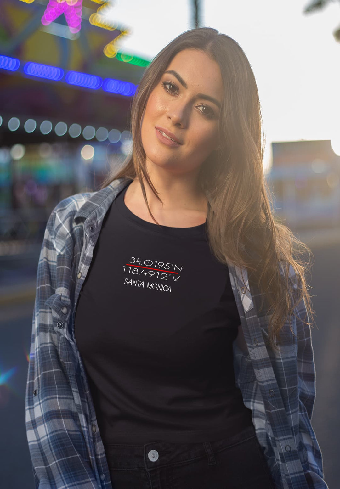 In the middle of the lively fair, she stands out with her bold beauty while wearing a Santa Monica black t-shirt.